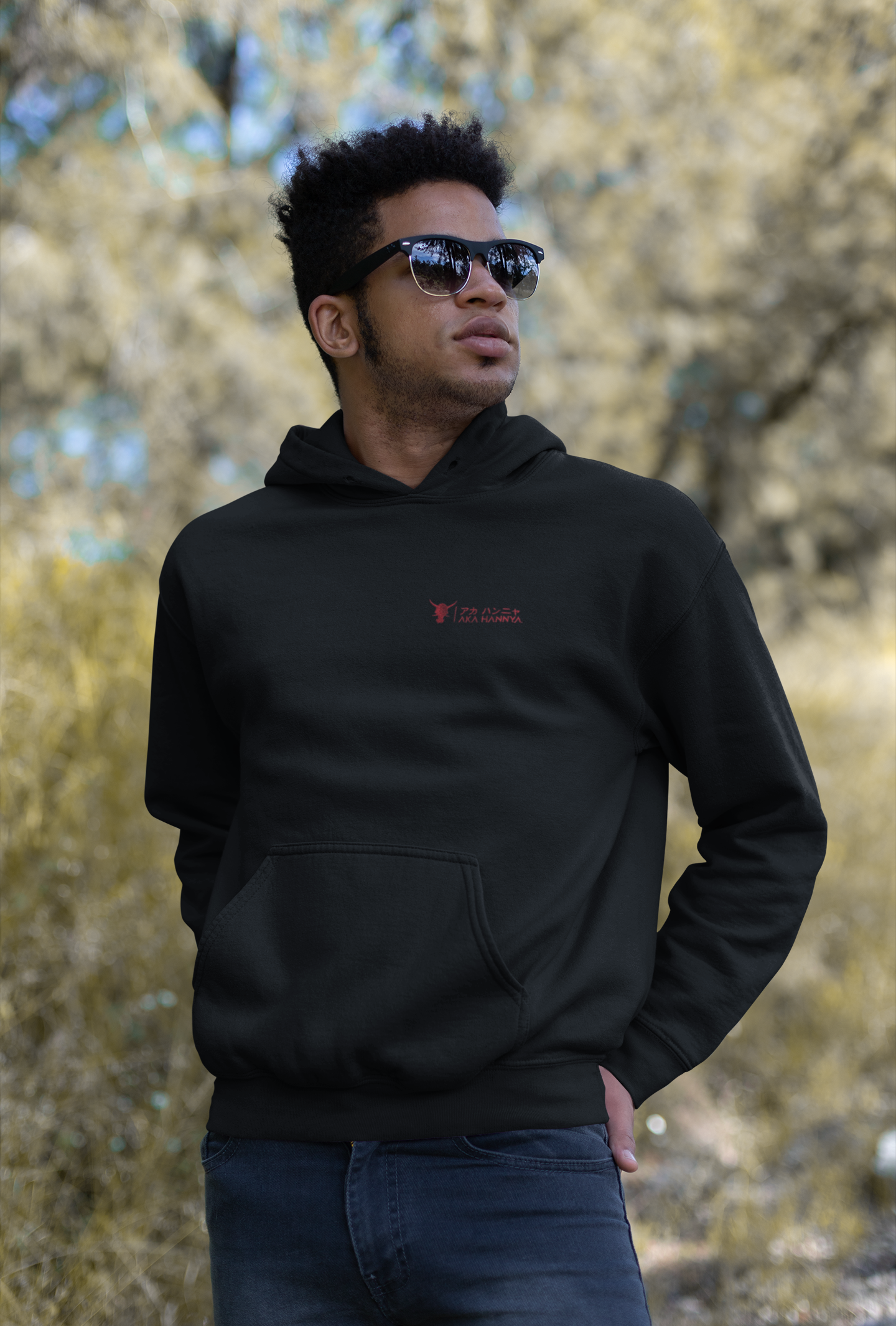 black premium eco hoodie outdoor on young male model outdoor with sunglasses
