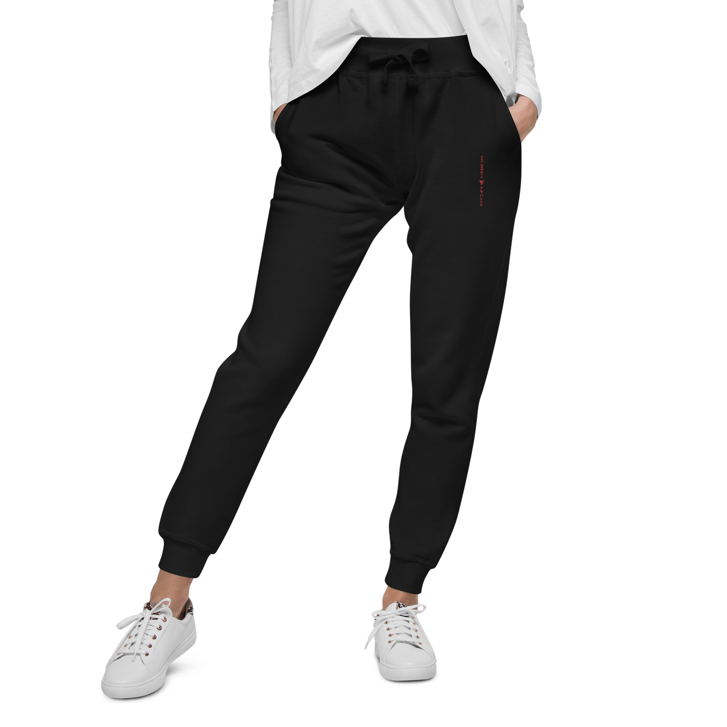 Black unisex fleece sweatpants on female model front side on transparent background