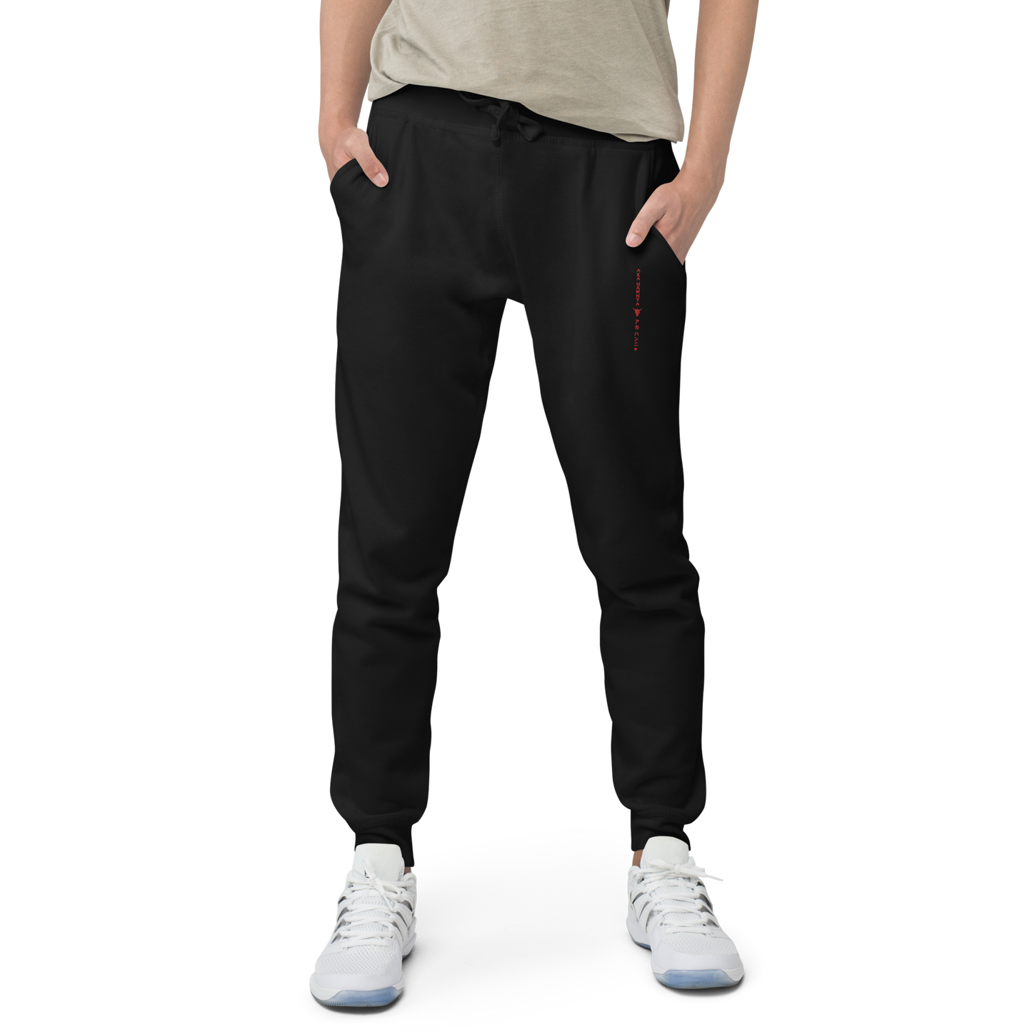 Black unisex fleece sweatpants on male model front side on transparent background