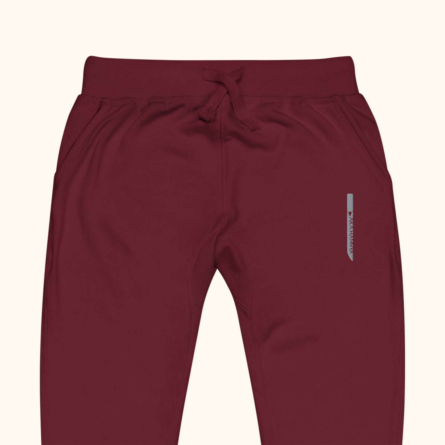 maroon unisex dagger fleece sweatpants close up on transparent background