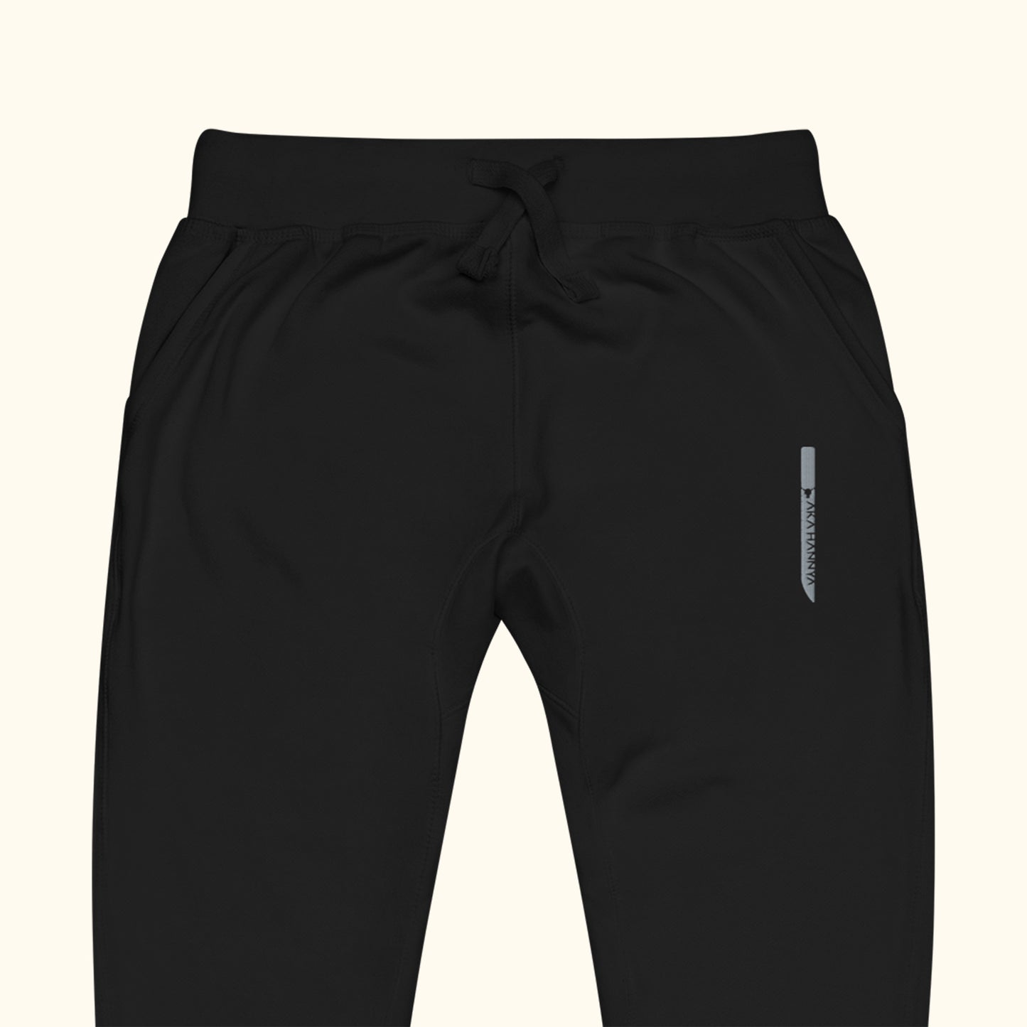 black unisex dagger fleece sweatpants close up on transparent background