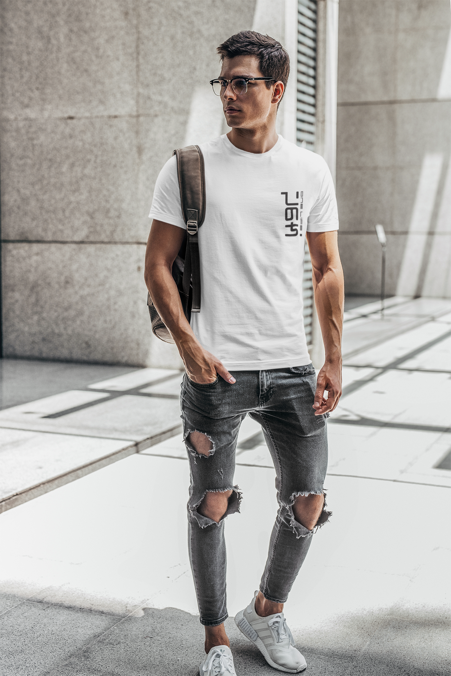 One-life t-shirt mockup of a man with glasses carrying a backpack on his shoulder